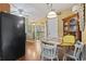 Cozy dining area with a round table and a black refrigerator at 752 Tall Oaks Ct., Myrtle Beach, SC 29588