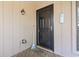 Charming front porch with a black front door and a 'welcome' mat at 752 Tall Oaks Ct., Myrtle Beach, SC 29588