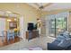 Cozy living room with balcony access, ceiling fan, open to dining area at 752 Tall Oaks Ct., Myrtle Beach, SC 29588
