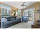 Bright living room with a large mirror, comfortable seating, and access to the balcony at 752 Tall Oaks Ct., Myrtle Beach, SC 29588