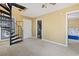 Living room with spiraling staircase, light-colored carpet and an open doorway at 752 Tall Oaks Ct., Myrtle Beach, SC 29588