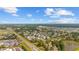 This aerial view displays a neighborhood with a pond and convenient access to roads and nearby shopping centers at 775 Plantation Dr. # 28, Little River, SC 29566