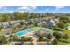 Aerial view showing the community pool, tennis courts, and manicured landscaping at 775 Plantation Dr. # 28, Little River, SC 29566
