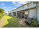 Rear view of home with a lawn and a view of the enclosed porches on the back at 775 Plantation Dr. # 28, Little River, SC 29566