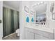 Bathroom with a shower-tub combo, white vanity, and neutral colors at 775 Plantation Dr. # 28, Little River, SC 29566
