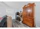 Bedroom with hardwood floors, natural light, closet, and ample storage cabinets at 775 Plantation Dr. # 28, Little River, SC 29566