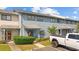 Charming townhouse with blue siding, landscaped front yard, and parking spot in front at 775 Plantation Dr. # 28, Little River, SC 29566