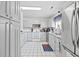 Bright and clean white kitchen featuring stainless steel appliances and tile flooring at 775 Plantation Dr. # 28, Little River, SC 29566
