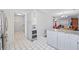 Bright kitchen with granite counters, white cabinetry and stainless steel appliances at 775 Plantation Dr. # 28, Little River, SC 29566