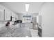 Bright and clean white kitchen featuring stainless steel appliances and granite counters at 775 Plantation Dr. # 28, Little River, SC 29566
