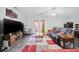 Comfortable living room with a large television, ceiling fan and access to outdoor space at 775 Plantation Dr. # 28, Little River, SC 29566