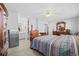 Spacious bedroom featuring a ceiling fan, plenty of natural light, and wood furniture at 775 Plantation Dr. # 28, Little River, SC 29566