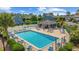 Community pool area with ample seating and manicured landscaping in view at 775 Plantation Dr. # 28, Little River, SC 29566