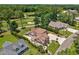 Captivating aerial view of the property highlighting the brick house, expansive lawn, and lush golf course scenery at 784 Caines Landing Rd., Conway, SC 29526