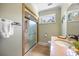 This bathroom features a single vanity, a standing shower, and a bright window at 784 Caines Landing Rd., Conway, SC 29526