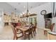 Formal dining room adjacent to the kitchen features a chandelier, hardwood floors, and ample seating at 784 Caines Landing Rd., Conway, SC 29526