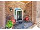 Inviting front entrance features a stone facade, decorative door with sidelights, and seating area at 784 Caines Landing Rd., Conway, SC 29526