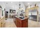 Large kitchen with a center island, stainless appliances, custom cabinets and open to dining area at 784 Caines Landing Rd., Conway, SC 29526