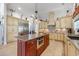 Spacious kitchen features custom cabinets, a center island with a sink, and stainless steel appliances at 784 Caines Landing Rd., Conway, SC 29526