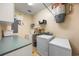 Functional laundry room with washer, dryer, sink, storage, and NuTone central vacuum system at 784 Caines Landing Rd., Conway, SC 29526