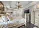 Stylishly decorated main bedroom features a decorative ceiling fan and an elegant furniture set at 784 Caines Landing Rd., Conway, SC 29526