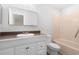 Clean bathroom features a modern vanity, ample lighting, and shower-tub combination at 814 Night Heron Ln., Myrtle Beach, SC 29572