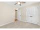 Inviting bedroom with soft carpet, a ceiling fan, and a spacious closet for storage at 814 Night Heron Ln., Myrtle Beach, SC 29572