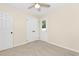 Neutral bedroom with a ceiling fan, closet, and direct access to the outdoors at 814 Night Heron Ln., Myrtle Beach, SC 29572