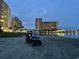Golf cart parked on the beach near luxury condo buildings provides convenient access to coastal amenities at 814 Night Heron Ln., Myrtle Beach, SC 29572