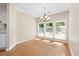 Light-filled dining area features hardwood floors and a modern chandelier at 814 Night Heron Ln., Myrtle Beach, SC 29572
