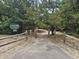 Inviting Briarcliffe Acres Association entrance with a well-maintained pathway surrounded by lush greenery at 814 Night Heron Ln., Myrtle Beach, SC 29572