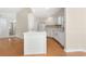 Bright kitchen with a center island, white cabinetry, stainless appliances, and hardwood flooring at 814 Night Heron Ln., Myrtle Beach, SC 29572