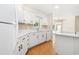 Updated kitchen featuring white cabinetry, stainless steel appliances, and a window over the sink at 814 Night Heron Ln., Myrtle Beach, SC 29572