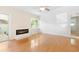 Cozy living room with a modern fireplace, white plank walls and ample natural light at 814 Night Heron Ln., Myrtle Beach, SC 29572