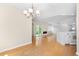 Open layout features a modern chandelier, fireplace, and seamlessly connects the dining and kitchen areas at 814 Night Heron Ln., Myrtle Beach, SC 29572