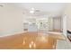 Spacious living room with hardwood flooring, vaulted ceilings, and an open layout leading to the kitchen at 814 Night Heron Ln., Myrtle Beach, SC 29572