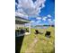 Inviting backyard with patio furniture and lounge chairs overlooking a tranquil pond at 8211 Forest Edge Dr., Myrtle Beach, SC 29579