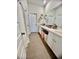 Elegant bathroom featuring a vanity with dual sinks, decorative mirrors, and white cabinets at 8211 Forest Edge Dr., Myrtle Beach, SC 29579