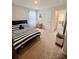 Inviting bedroom with striped bedding, natural light, and comfortable layout at 8211 Forest Edge Dr., Myrtle Beach, SC 29579