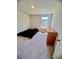 Bedroom featuring a single bed, dresser, and window, ideal for restful nights at 8211 Forest Edge Dr., Myrtle Beach, SC 29579