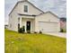 Charming home with a welcoming front door and attached two-car garage, set against a cloudy sky at 8211 Forest Edge Dr., Myrtle Beach, SC 29579