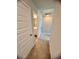 Hallway that leads to a bathroom, with neutral carpet and white doors at 8211 Forest Edge Dr., Myrtle Beach, SC 29579
