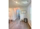 Bright hallway with wood flooring and decorative accents, enhancing the home's welcoming atmosphere at 8211 Forest Edge Dr., Myrtle Beach, SC 29579