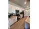 Modern kitchen featuring white cabinets, granite countertops and stainless steel appliances at 8211 Forest Edge Dr., Myrtle Beach, SC 29579
