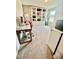 Spacious office with custom shelving, a modern desk, and ample natural light at 8211 Forest Edge Dr., Myrtle Beach, SC 29579