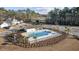 Aerial view shows a neighborhood pool with a covered gazebo and playground in a desirable community at 8211 Forest Edge Dr., Myrtle Beach, SC 29579