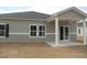 Attractive home exterior with a covered patio, ideal for relaxing and entertaining at 863 Long Beach Dr, Loris, SC 29569