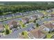 Scenic aerial view of waterfront townhomes, lush landscaping, and a tranquil canal in a well-maintained neighborhood at 8855 Radcliff Dr. Nw # 53C, Calabash, NC 28467