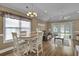 Bright living room features wood floors, vaulted ceiling, slider doors to the screened in patio, and a dining area at 8855 Radcliff Dr. Nw # 53C, Calabash, NC 28467