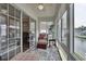 Covered and screened patio features a ceiling fan and expansive views of the backyard and water at 8855 Radcliff Dr. Nw # 53C, Calabash, NC 28467